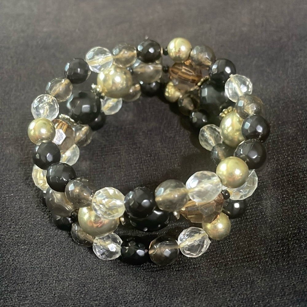 Stretch bracelet with 3rows of black, silver and clear beads